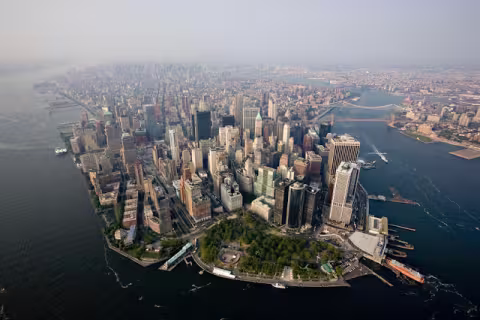 Office and residential buildings stand in the financial district of Manhattan in this aerial photograph taken over New York, U.S., on Wednesday, July 7, 2010. Photographer: Daniel Acker/Bloomberg